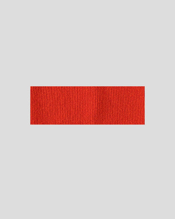 frontalansicht eines haarbands aus merinowolle in der farbe rot/orange