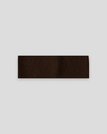 frontalansicht eines haarbands aus merinowolle in der farbe braun