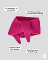 frontansicht eines minischals aus merinowolle in pink inklusive produktvorteilen