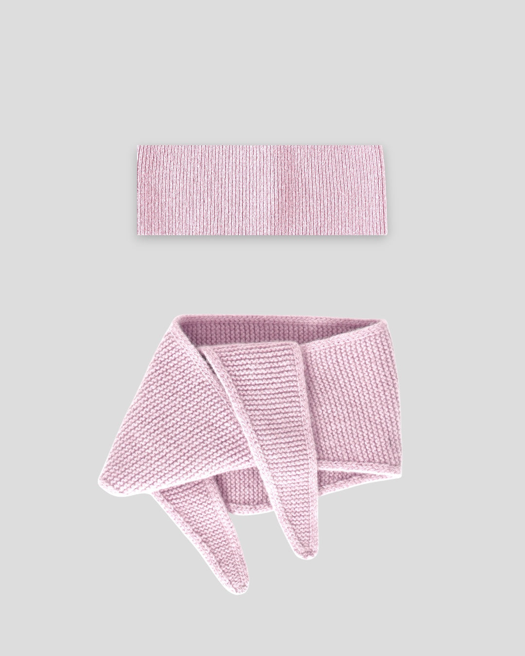 frontalansicht eines haarbands und mini schals aus merinowolle in der farbe pink